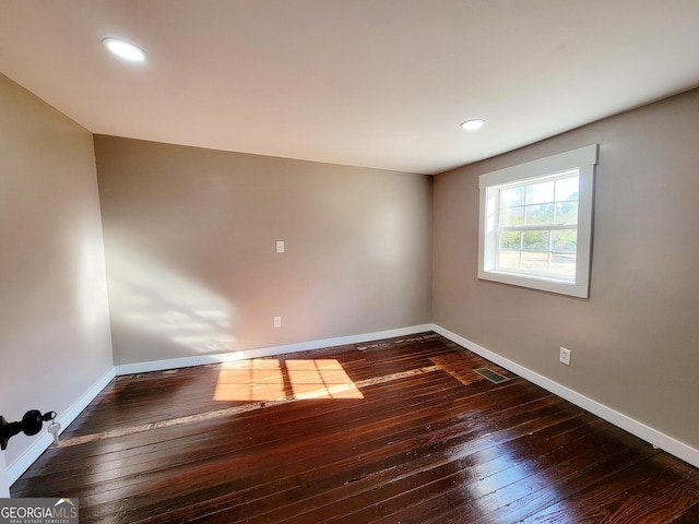 empty room featuring dark hardwood / wood-style floors