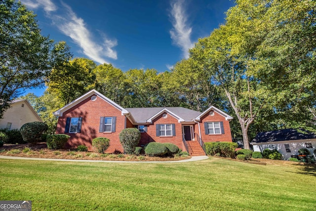 single story home featuring a front yard