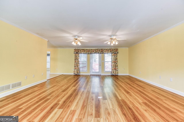 unfurnished room with ceiling fan, light wood-type flooring, and crown molding