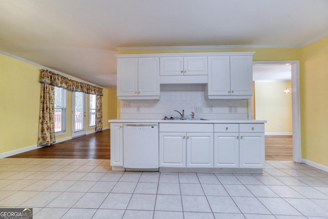 kitchen with white dishwasher, white cabinetry, and ornamental molding