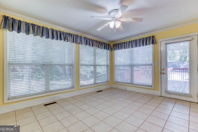 interior space with ceiling fan