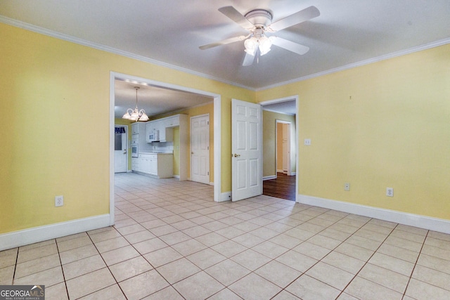 unfurnished room with light tile patterned floors, ceiling fan with notable chandelier, and ornamental molding