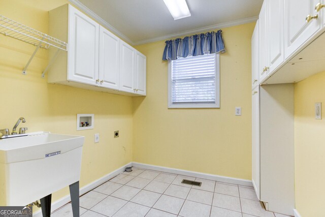 clothes washing area with hookup for an electric dryer, cabinets, ornamental molding, and washer hookup