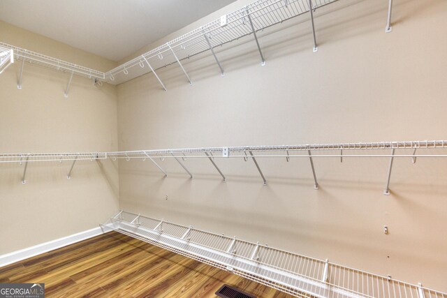 walk in closet featuring wood-type flooring