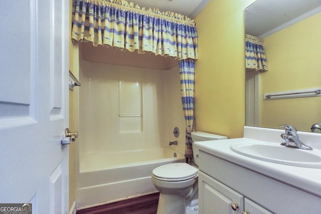 full bathroom featuring shower / tub combo, vanity, crown molding, wood-type flooring, and toilet