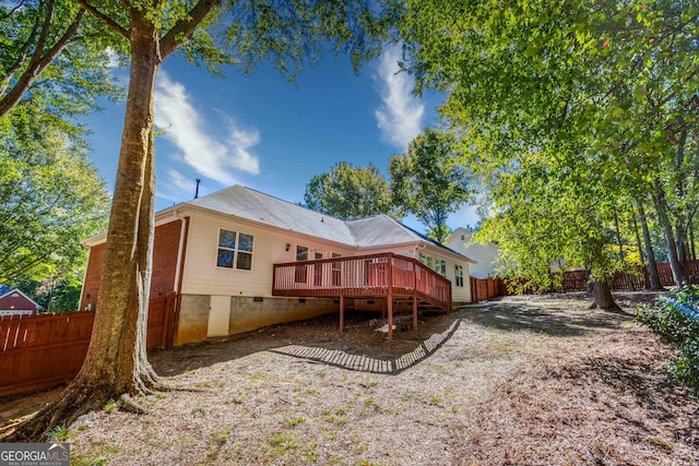 rear view of house featuring a deck