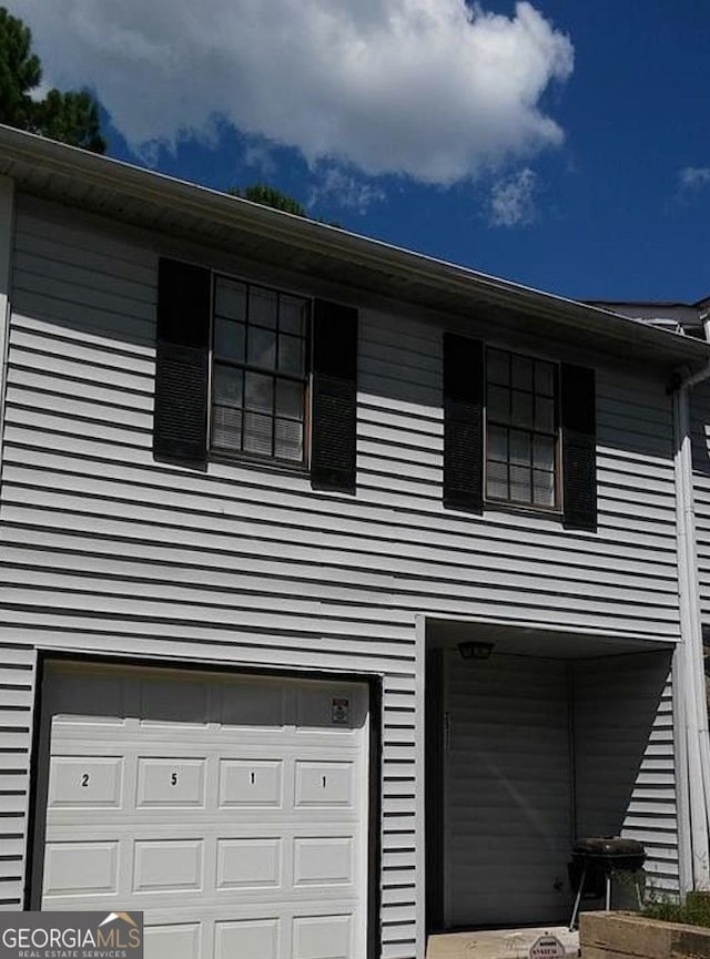 view of side of property featuring a garage