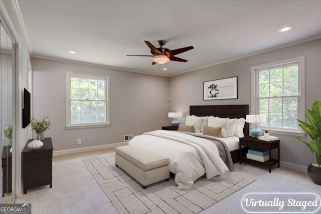 bedroom featuring light carpet, ceiling fan, and ornamental molding