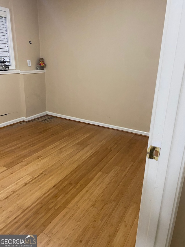 spare room with light wood-type flooring