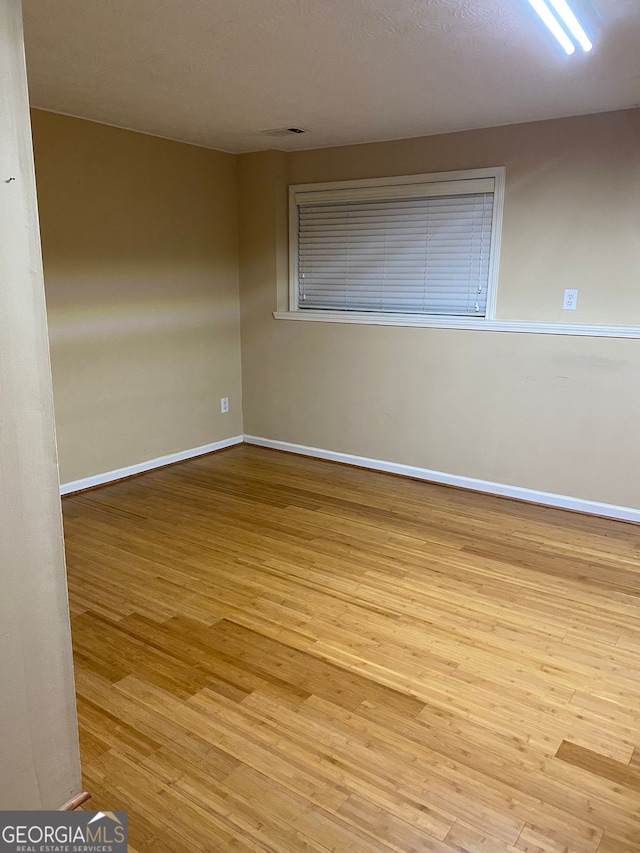 empty room with light wood-type flooring