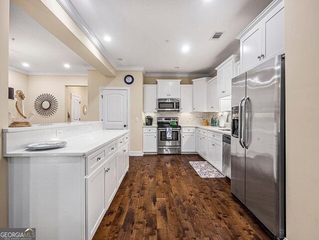 kitchen with ceiling fan, crown molding, dark hardwood / wood-style floors, white cabinetry, and hanging light fixtures