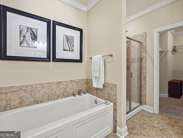 bathroom featuring tile patterned floors, crown molding, and shower with separate bathtub