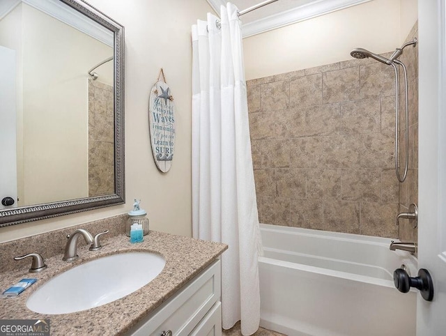 bathroom with vanity, shower / bathtub combination with curtain, and ornamental molding