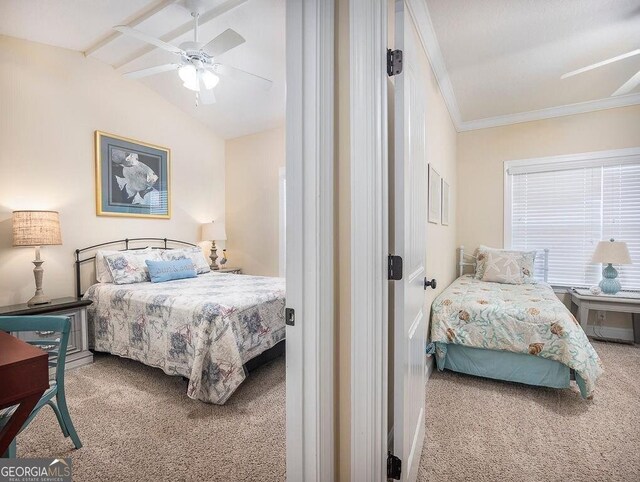 carpeted bedroom featuring ceiling fan and vaulted ceiling