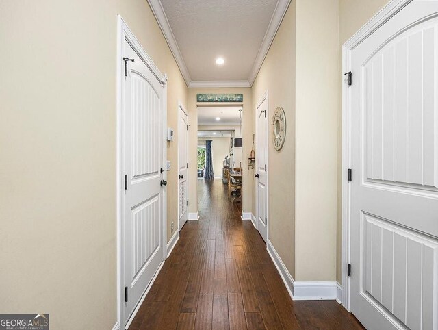 dining room with dark hardwood / wood-style floors and crown molding