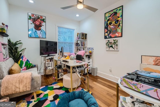 recreation room with hardwood / wood-style floors and ceiling fan