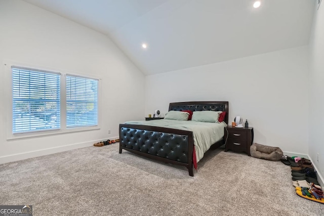 carpeted bedroom featuring lofted ceiling