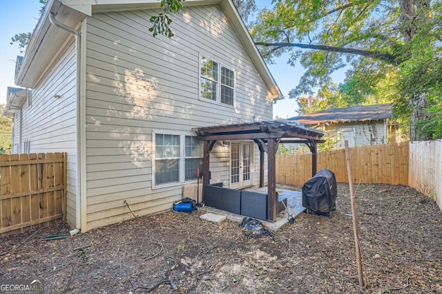 back of house with a pergola