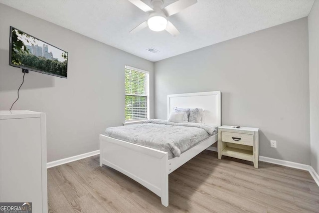 bedroom featuring ceiling fan and light wood-type flooring