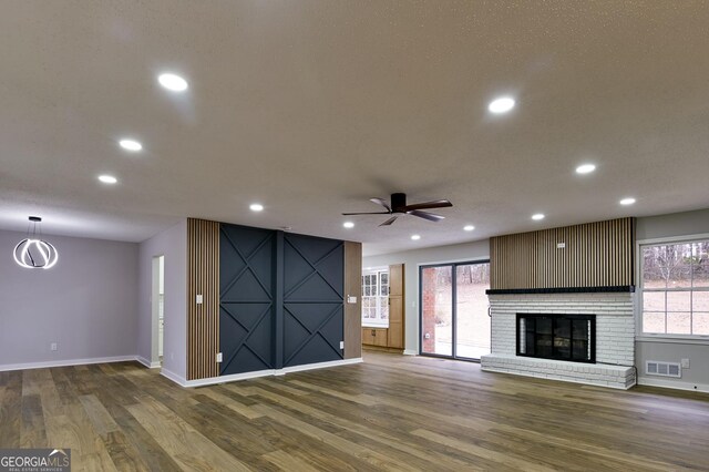 unfurnished living room featuring light hardwood / wood-style floors and ceiling fan