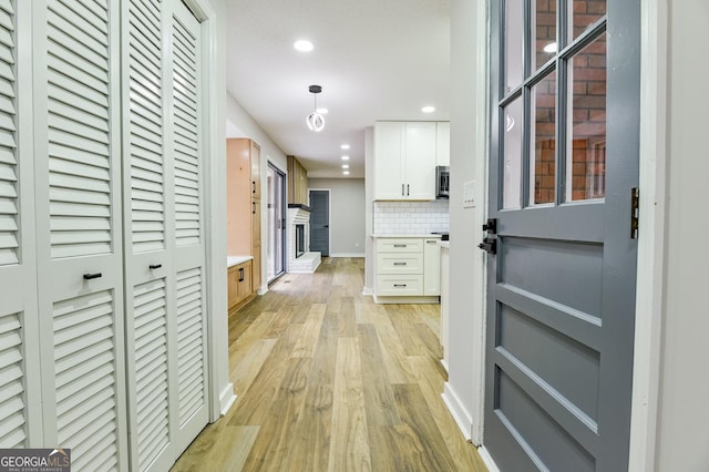 hall featuring light hardwood / wood-style flooring