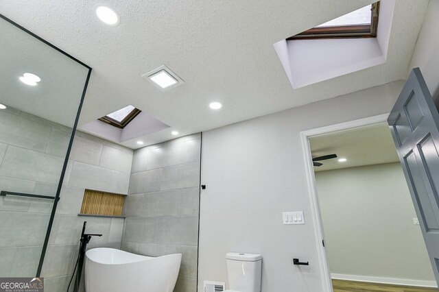 walk in closet featuring hardwood / wood-style floors