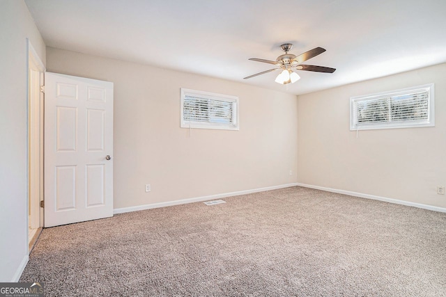 unfurnished room with carpet and ceiling fan