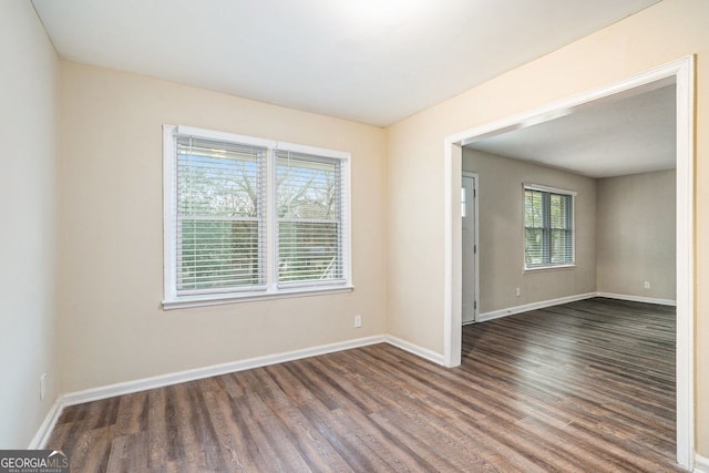 spare room featuring dark hardwood / wood-style floors