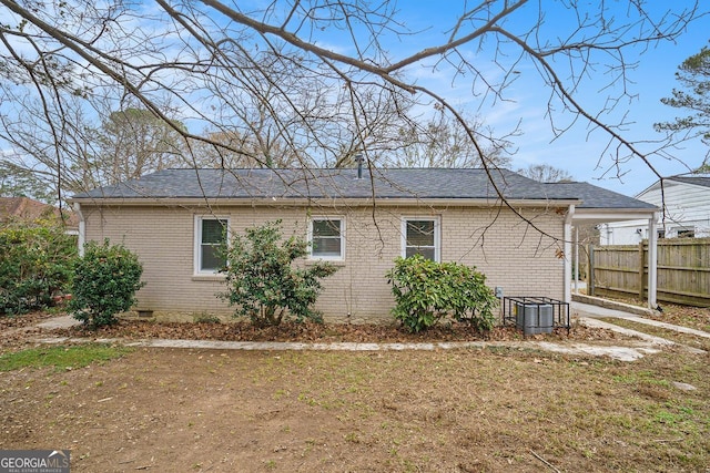 view of side of home featuring cooling unit