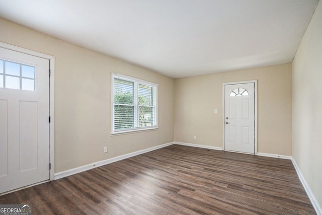 foyer entrance featuring dark hardwood / wood-style floors