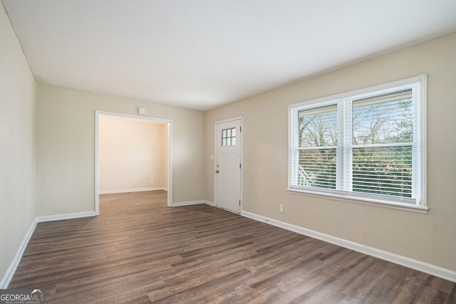 entrance foyer with dark hardwood / wood-style floors