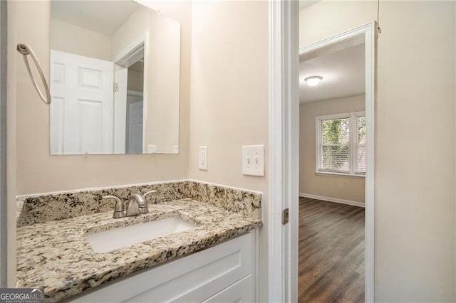 bathroom featuring vanity and wood-type flooring