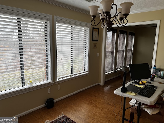 office featuring ornamental molding, a textured ceiling, a wealth of natural light, and a notable chandelier