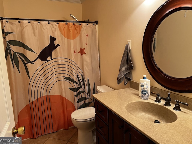 bathroom with tile patterned flooring, vanity, and toilet