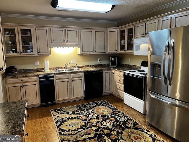 kitchen with a textured ceiling, white appliances, ornamental molding, and sink