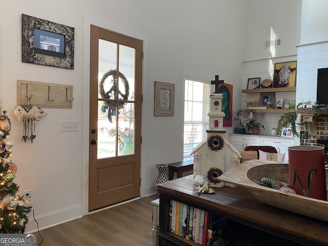 entryway with hardwood / wood-style floors