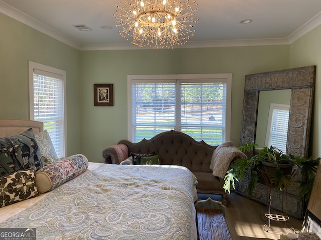 bedroom with a chandelier, hardwood / wood-style floors, and crown molding