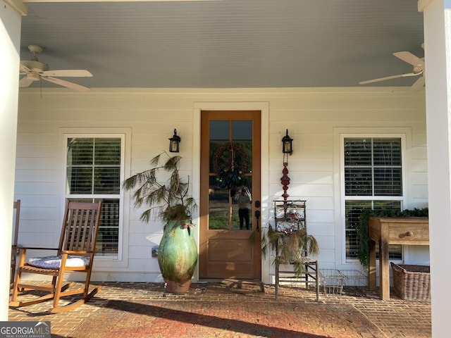 view of exterior entry featuring ceiling fan