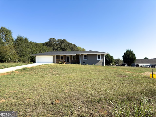 single story home with a front yard and a garage