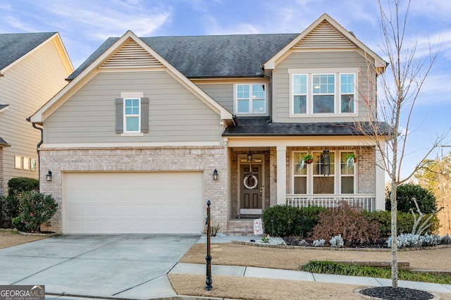 craftsman-style house featuring covered porch and a garage