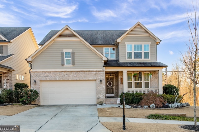 craftsman-style house featuring a porch and a garage