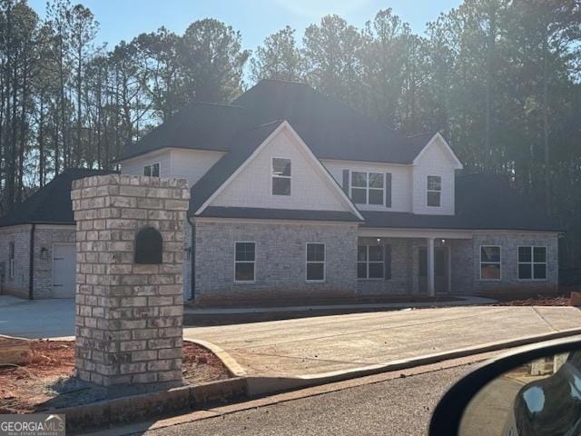 view of front of home featuring a swimming pool