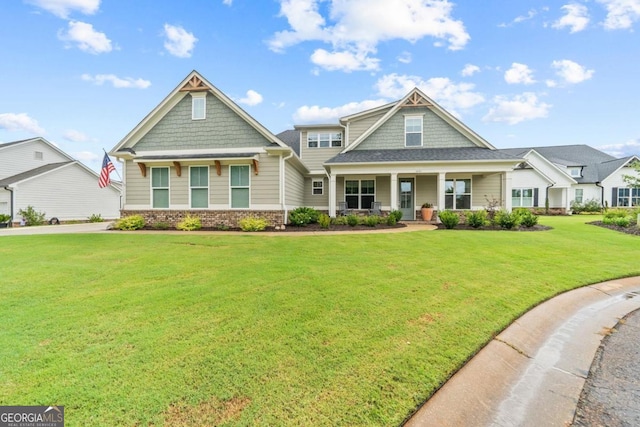 craftsman-style house with a front yard and a porch