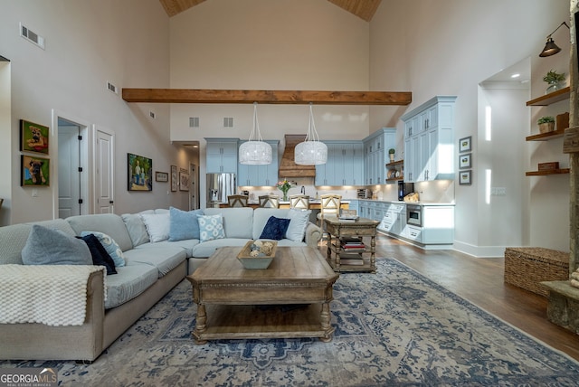 living room with dark hardwood / wood-style flooring and a high ceiling