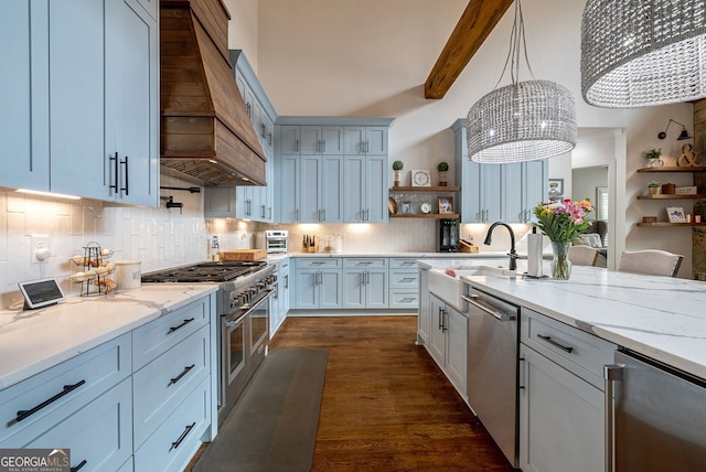 kitchen with beam ceiling, a chandelier, pendant lighting, custom range hood, and appliances with stainless steel finishes