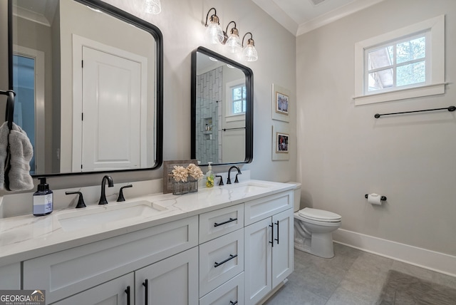 bathroom with vanity, toilet, and ornamental molding