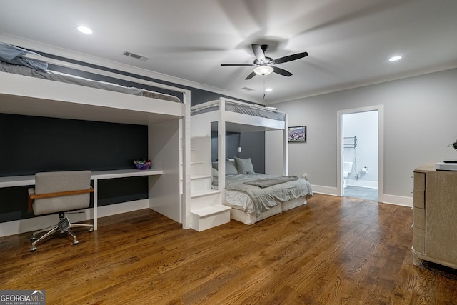 bedroom featuring wood-type flooring, ensuite bathroom, ceiling fan, and crown molding