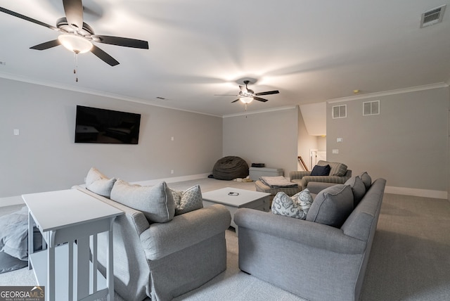 living room with ceiling fan, crown molding, and light carpet