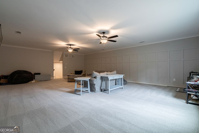 interior space with ceiling fan, crown molding, and light carpet