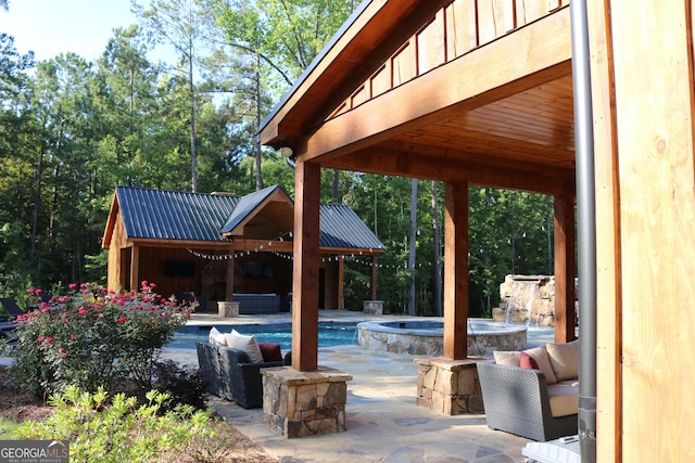 view of patio featuring a swimming pool with hot tub and an outdoor hangout area